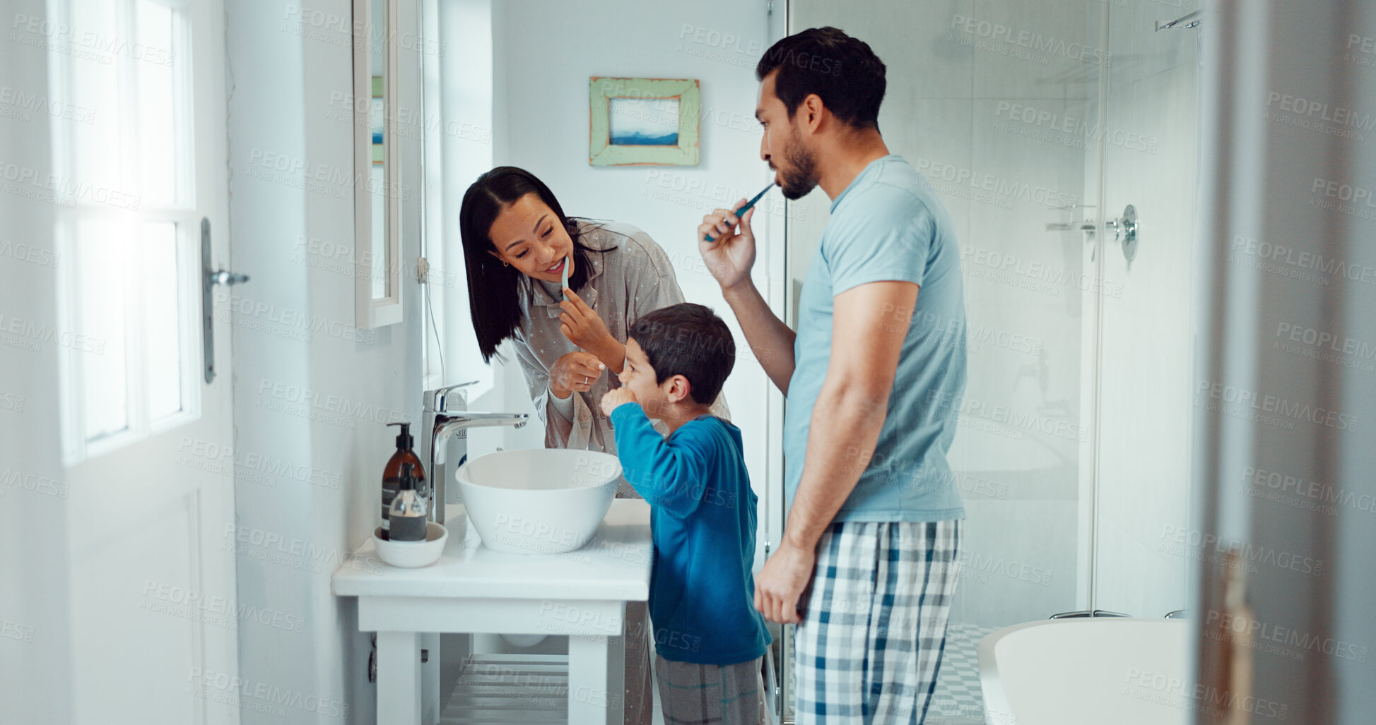 Buy stock photo Parents, child and brushing teeth in family home bathroom while learning or teaching dental hygiene. A woman, man and kid with toothbrush and toothpaste for health, cleaning mouth and wellness