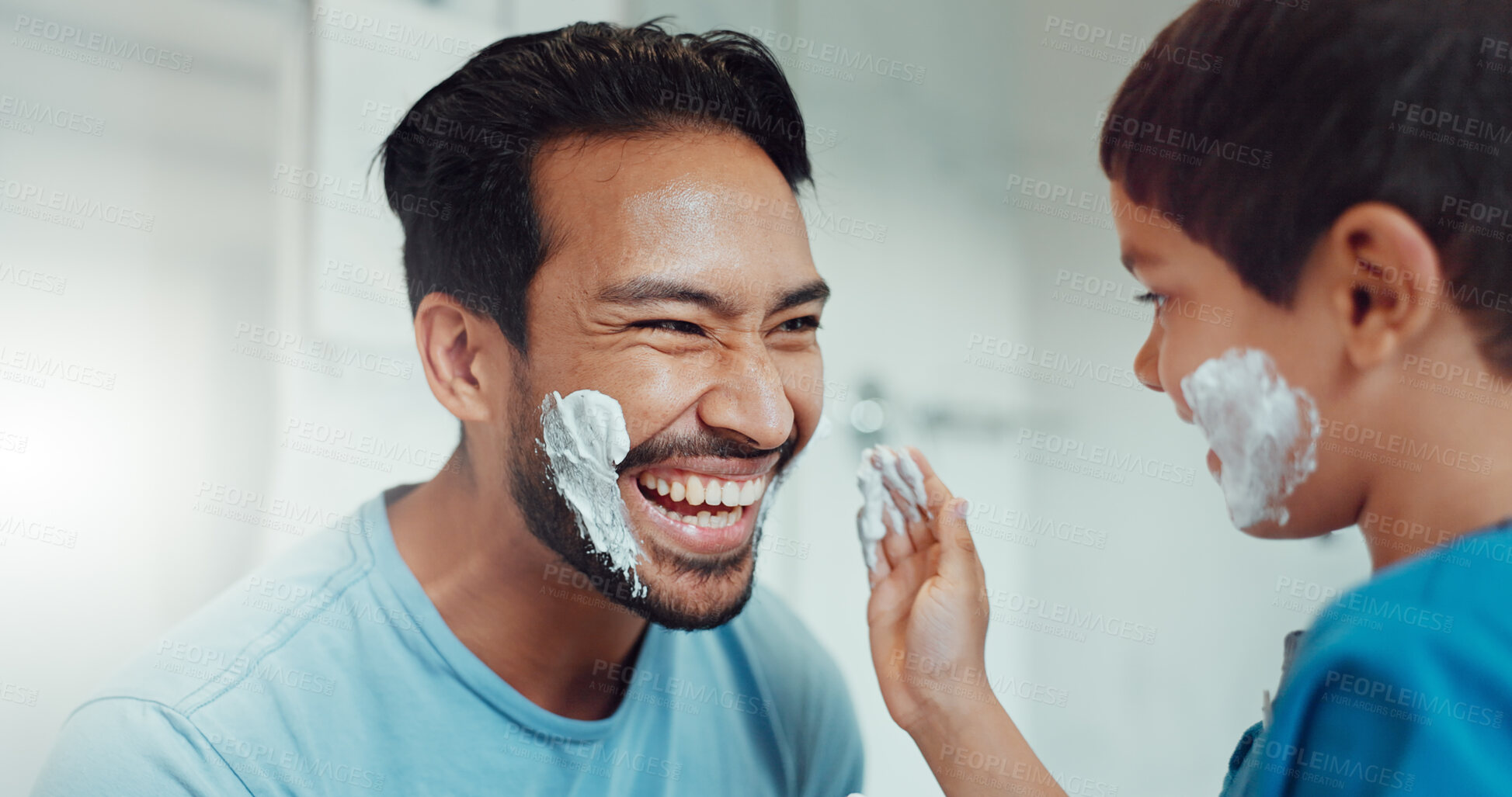 Buy stock photo Shaving, bathroom and father teaching child about grooming, playing hygiene and facial routine. Playful, help and dad showing boy kid cream or soap for hair removal together in a house in the morning