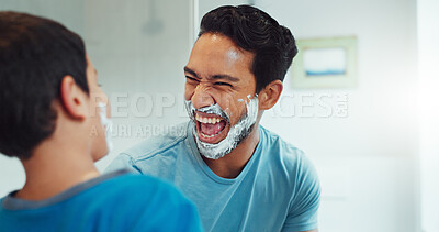 Shaving cream, child and father together in bathroom, family home or boy learning morning skincare, beauty and grooming routine. Funny, happy dad and son helping with foam, razor and skin care
