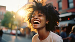 Happy young woman in street.
Laughing with arms up. Freedom concept.