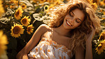 Attractive woman in field of sunflowers during sunset. Fashion concept.