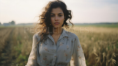 Editorial portrait of woman in field of grass. Country side. Fashion concept.