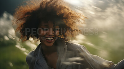 Happy young woman. Dancing in field of flowers. Motion blurred background.