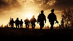 Silhouette of armed soldiers or marines walking in a row. 
War concept.