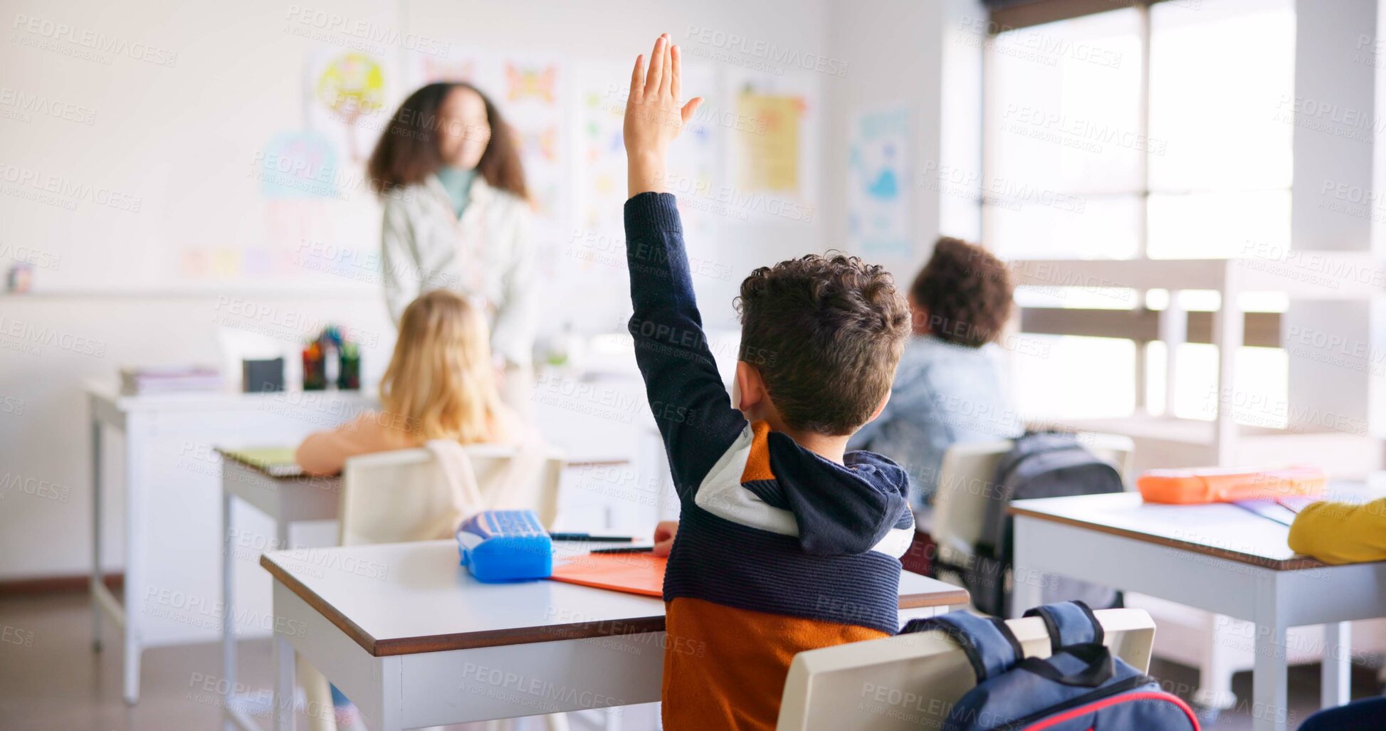 Buy stock photo Education, raised hand and boy student in classroom with teacher for learning, discussion and knowledge. Help, studying and children students with questions for female educator or tutor at school.