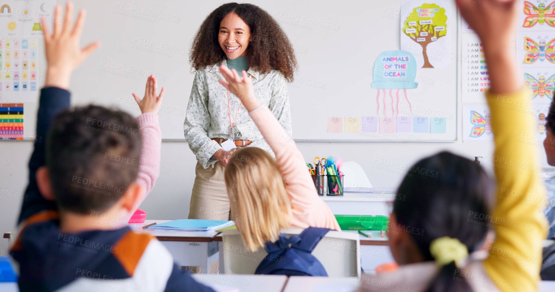 Buy stock photo Education, raised hand and woman teacher in classroom with kids for learning, discussion and knowledge. Help, studying and children students with questions for female educator or tutor at school.