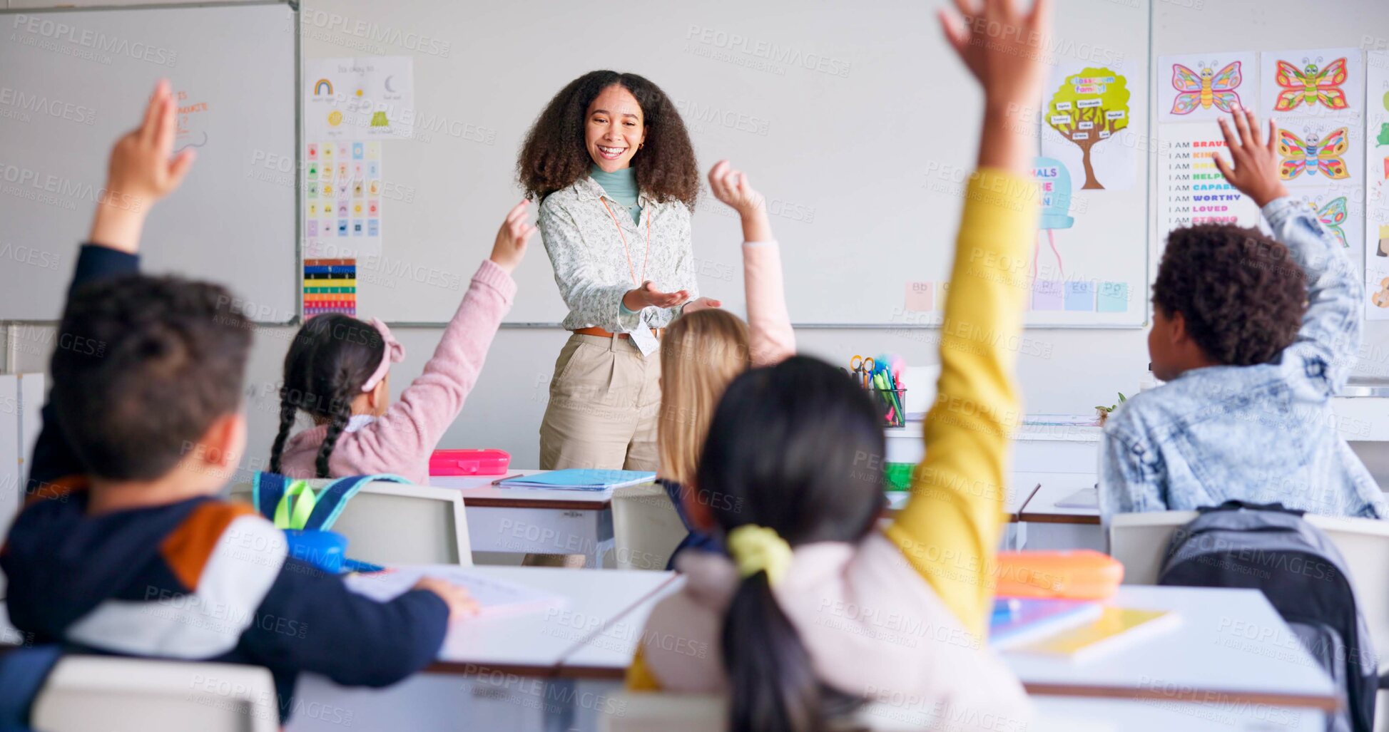 Buy stock photo School, raised hand and woman teacher in classroom with kids for learning, discussion and knowledge. Help, studying and children students with questions for female educator or tutor for education.