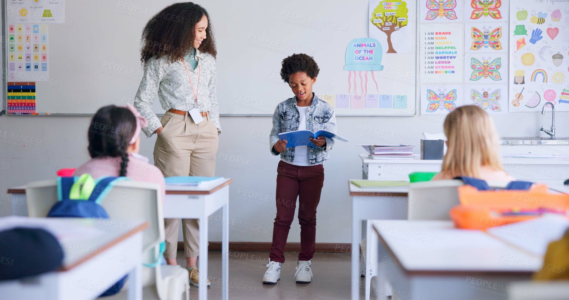 Buy stock photo School, child and reading a book in class for learning, development and communication. A african boy kid or student and teacher woman for language, support and assessment in elementary classroom