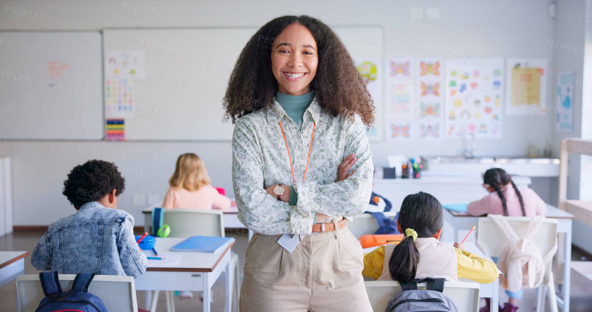 Buy stock photo Portrait, smile and a teacher arms crossed in a classroom for education during a lesson at school to study. Future, learning and children with a woman educator teaching a class of student kids