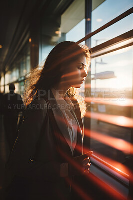 Portrait of business woman in airport. Beautiful light streak effect. Editorial concept.