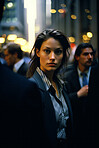 Contrasted portrait of business woman in busy street. Editorial concept.