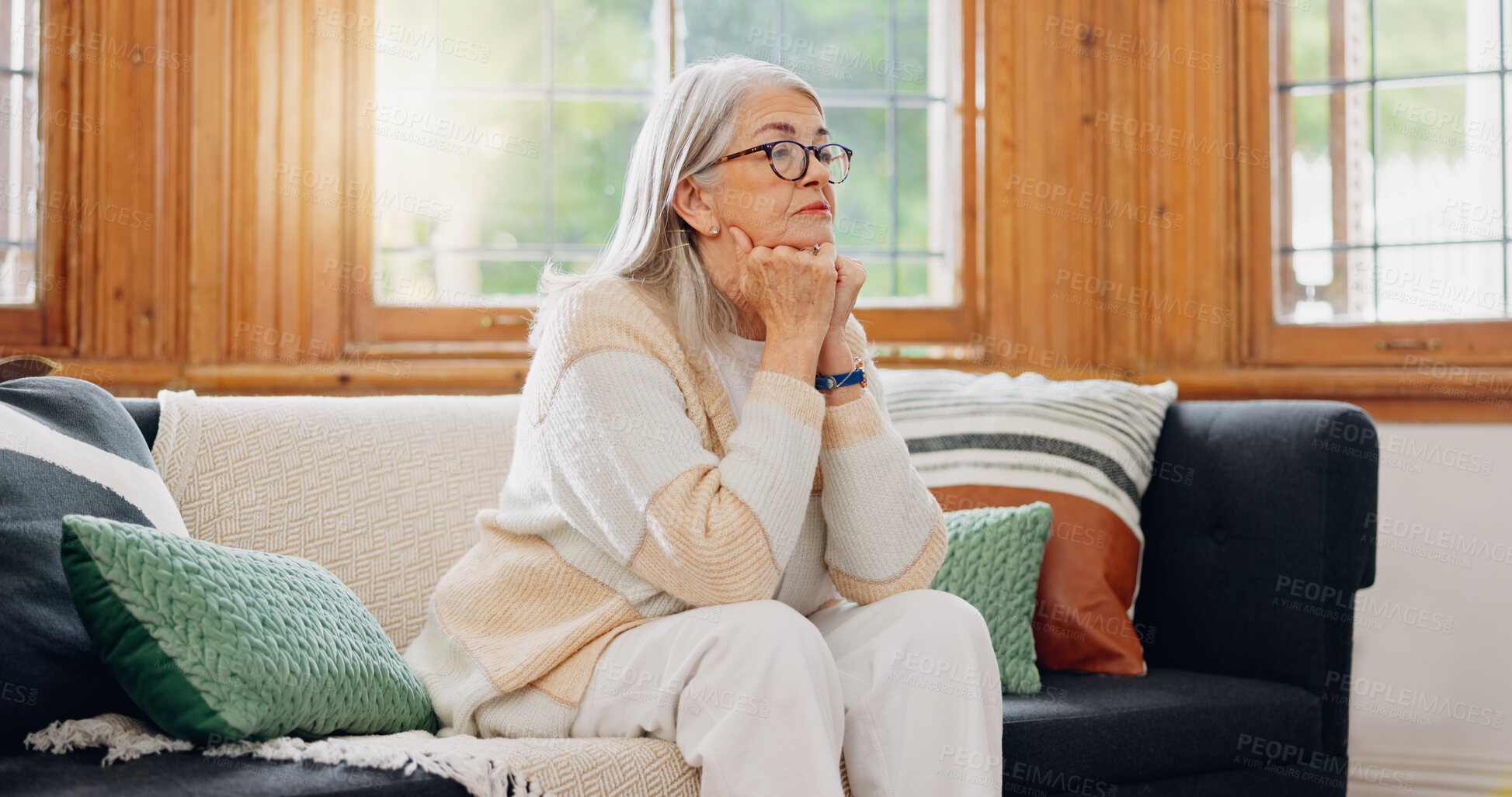 Buy stock photo Thinking, reflection and senior woman on sofa in the living room with memory or dreaming face. Relax, idea and elderly female person in retirement with alzheimers disease in the lounge of modern home