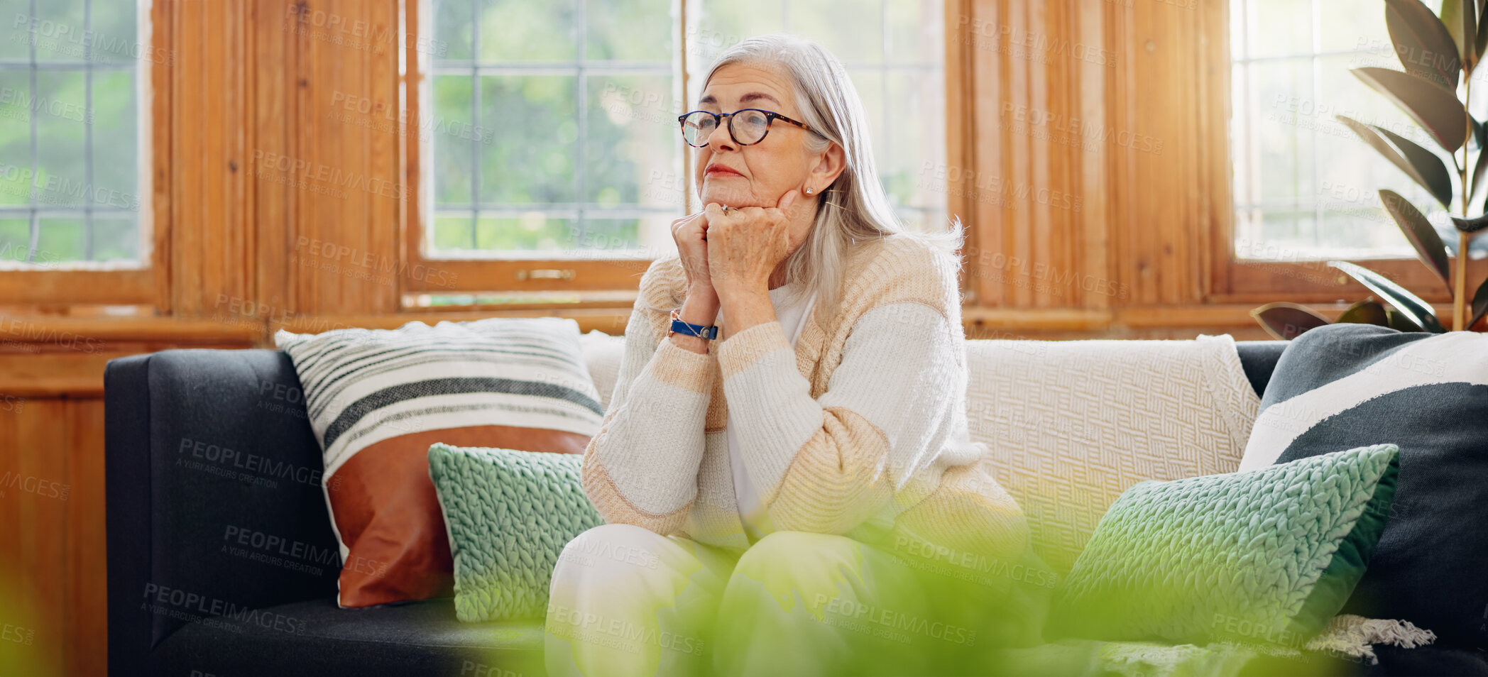 Buy stock photo Thinking, reflection and senior woman on sofa in the living room with memory or dreaming face. Relax, idea and elderly female person in retirement with alzheimers disease in the lounge of modern home