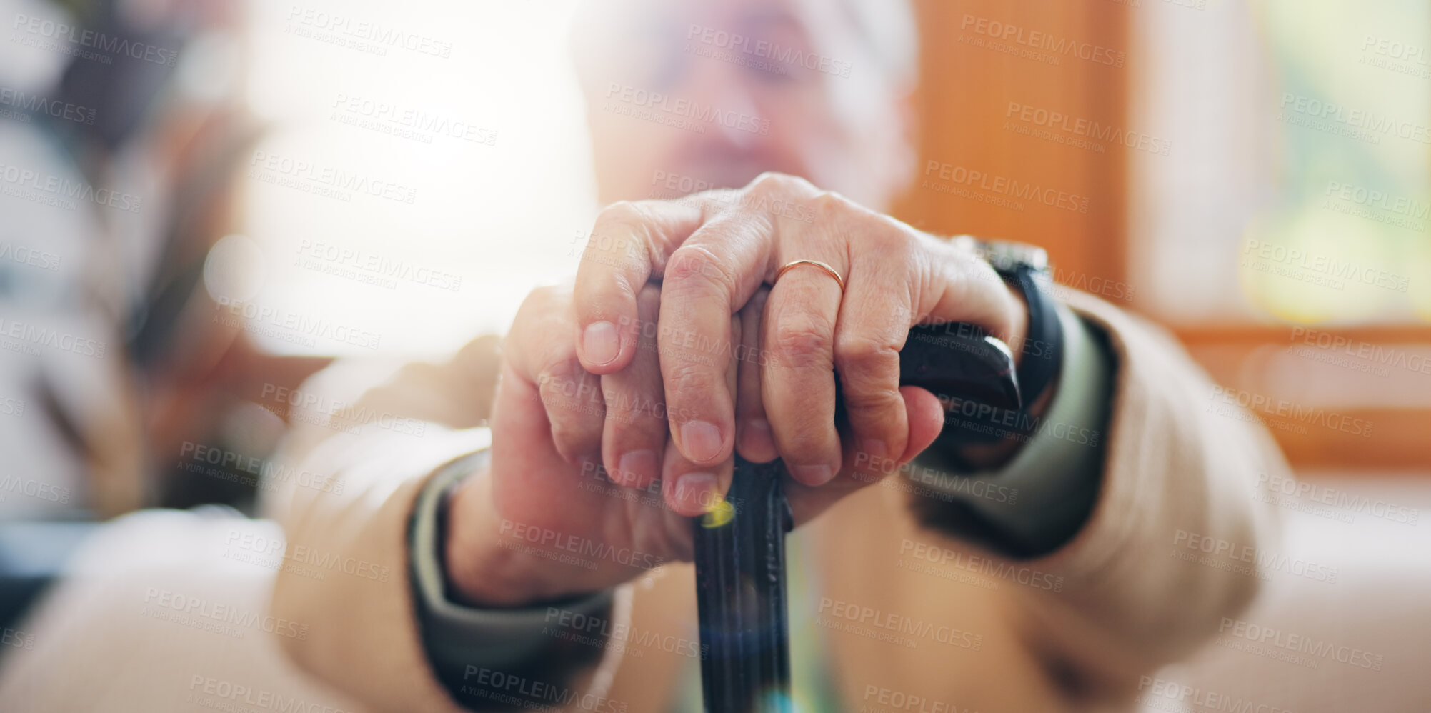 Buy stock photo Walking stick, hands and senior man with a disability in home, apartment or retirement with support for injury. Elderly, closeup or person with wood cane to help balance or mobility with arthritis