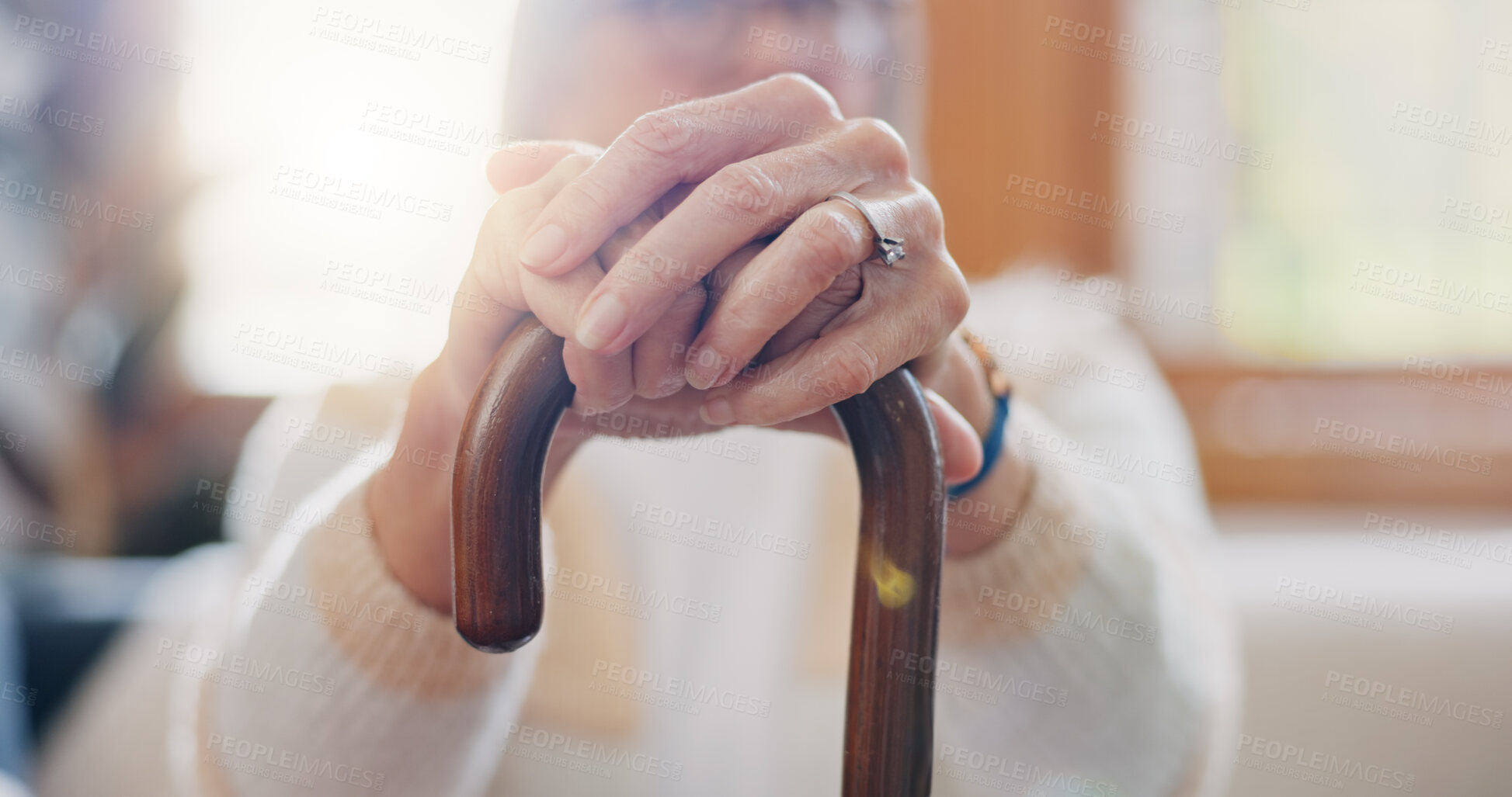 Buy stock photo Walking stick, hands and senior woman with a disability in home, apartment or retirement with support for injury. Elderly, closeup or person with wood cane to help balance or mobility with arthritis