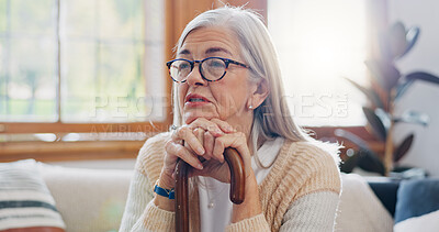Home, thinking and senior woman with anxiety, sad and retirement with depression, mental health or dementia. Mature person, old lady or pensioner with walking stick, alzheimer and relax in a lounge