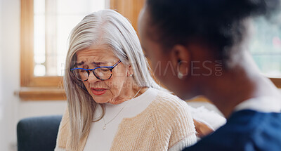 Senior, sad woman speaking or nurse with support or results in consultation for bad news or cancer. Stress, depression or caregiver with a crying mature patient for empathy, sympathy or help in home