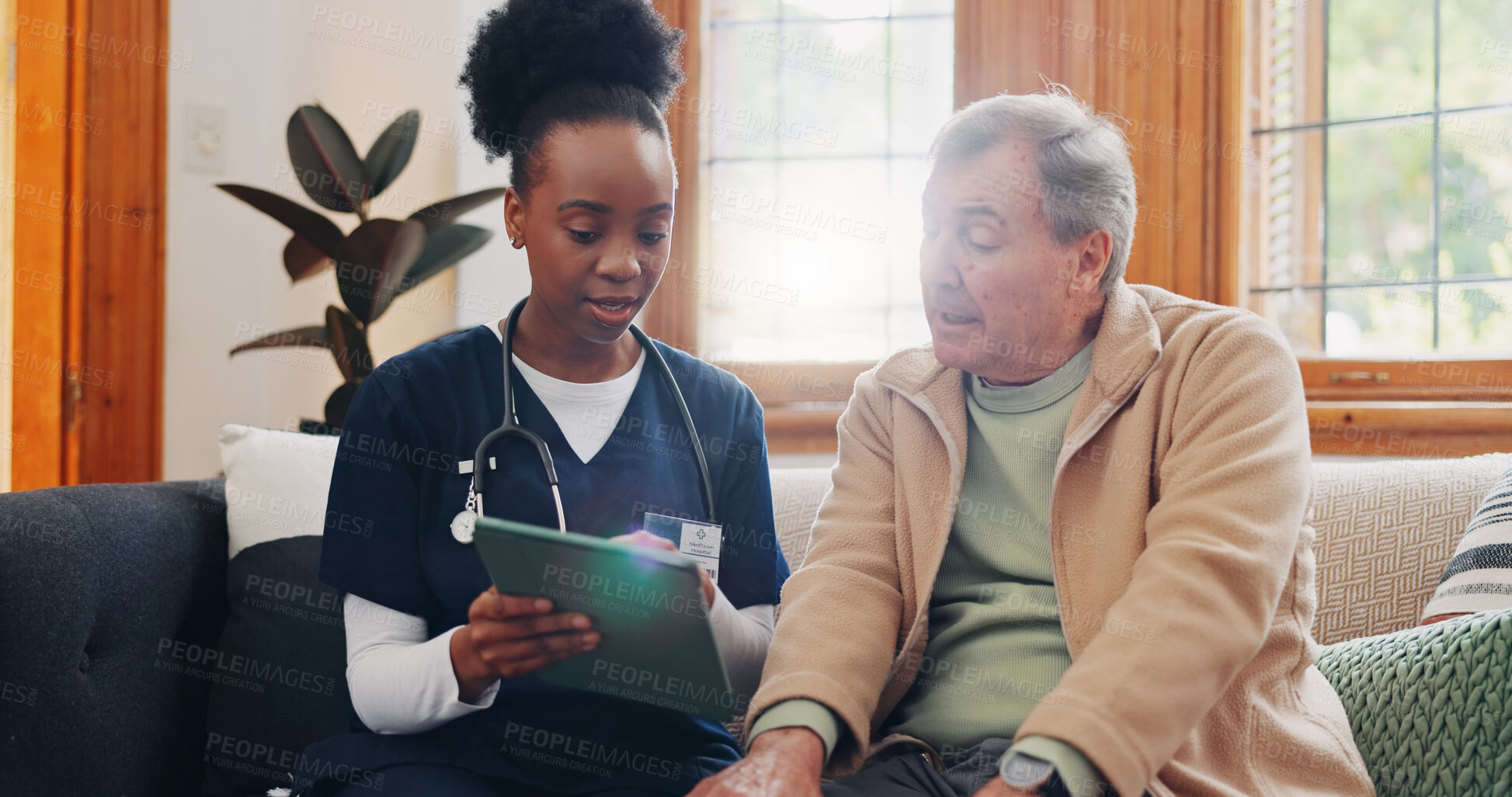 Buy stock photo Senior, man and caregiver with tablet for consulting, medical information and communication with lens flare. Elderly, professional and nurse with touchscreen for online report, advisory and results