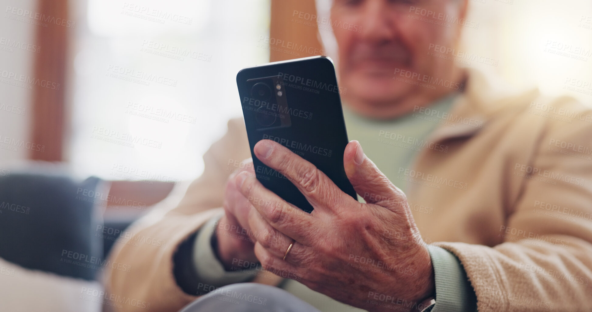 Buy stock photo Smartphone and hands of senior man typing online on internet search in retirement home. Phone, elderly person ecommerce and scroll on health website, communication or social media