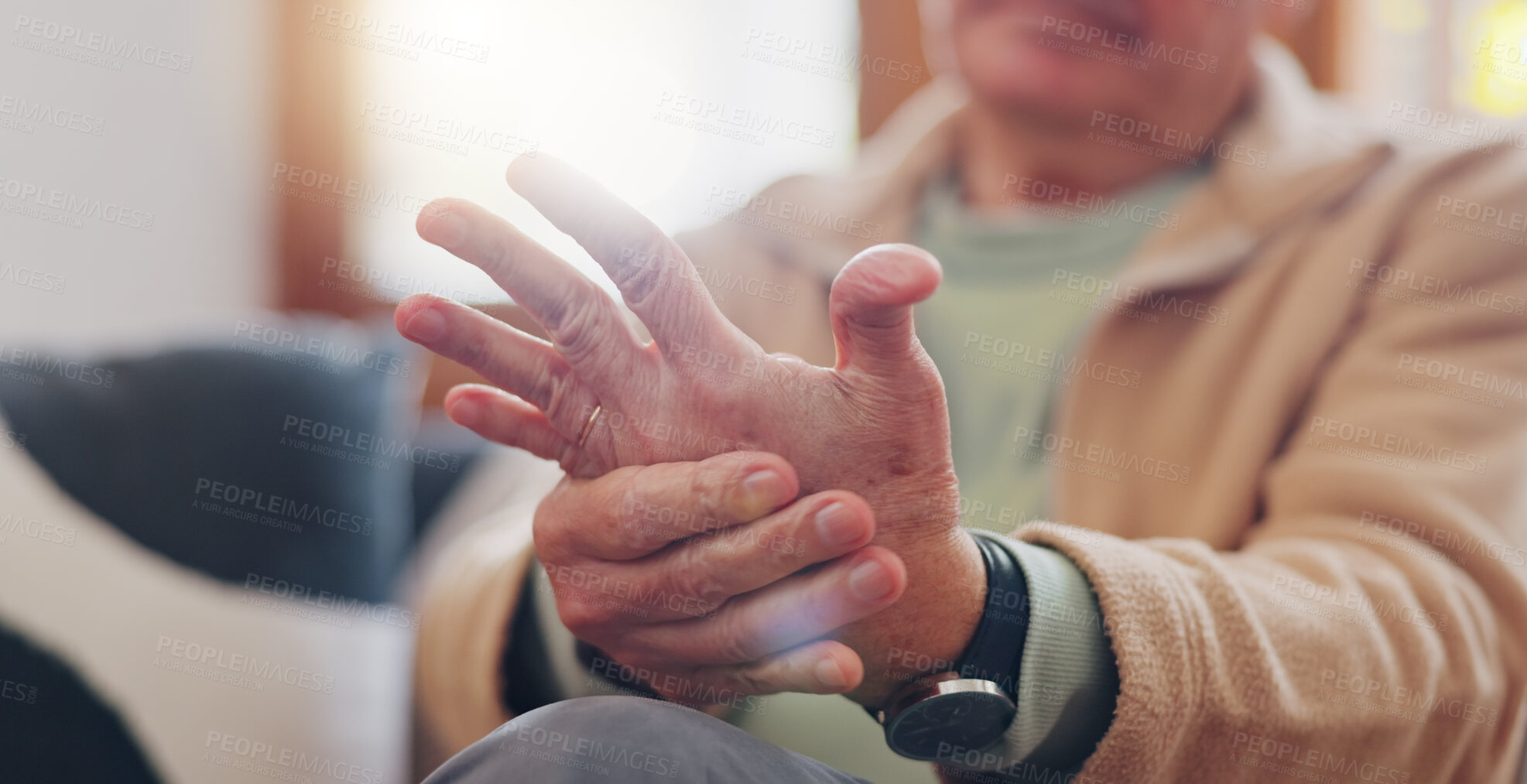 Buy stock photo Closeup, hands and senior man with wrist pain, injury and inflammation with bruise, home and broken. Zoom, pensioner and elderly guy on a couch, fingers with ache and arthritis with sprain and strain