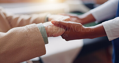 Nurse holding hands with a senior patient for empathy, trust or support of help, advice or healthcare. Consulting, elderly person or medical therapy with doctor for hope, consultation or depression