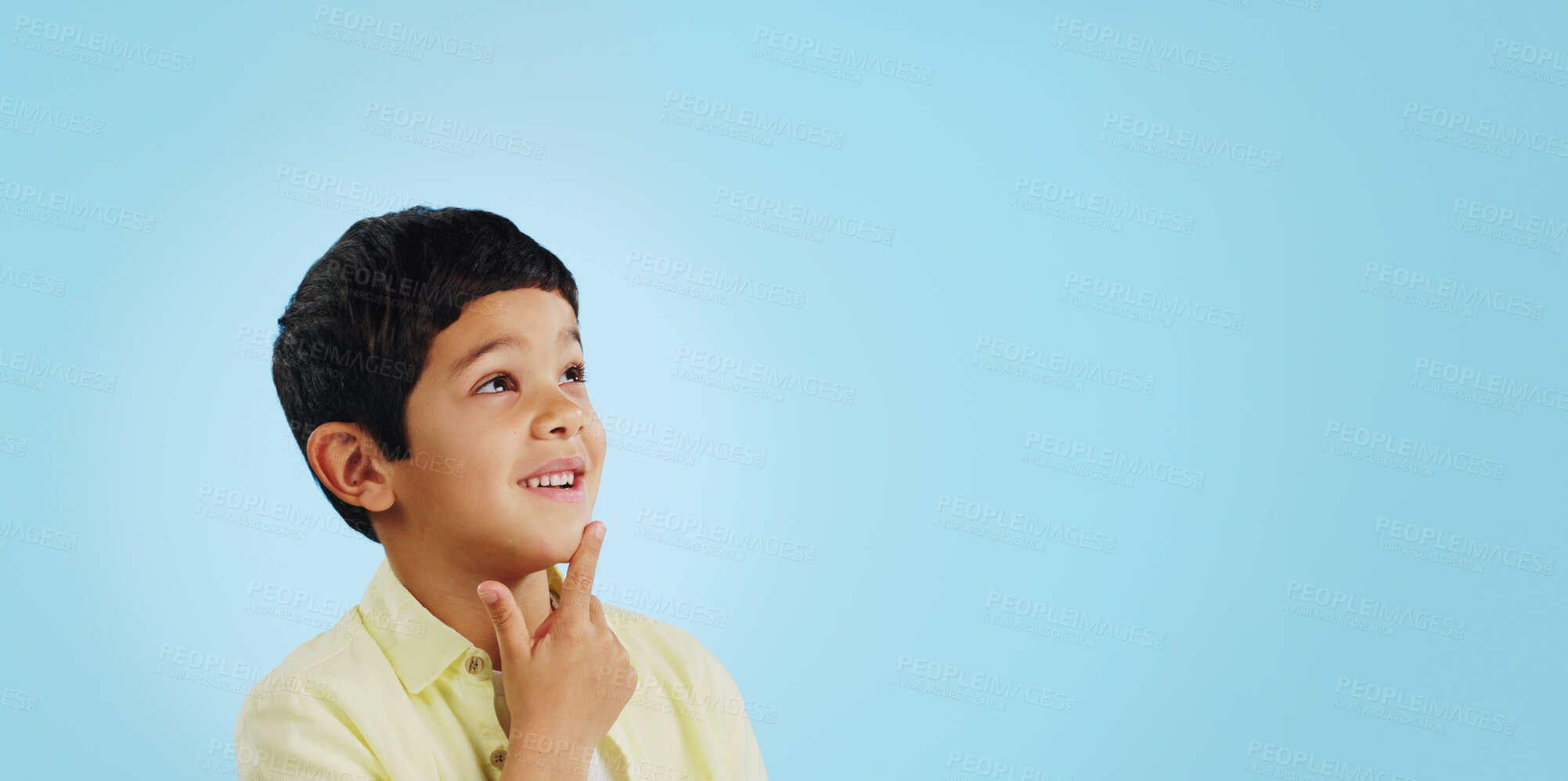 Buy stock photo Surprise, boy and child with decision, thinking and brainstorming on a blue studio background. Ideas, mockup space and happy kid looking up, future and announcement with planning, choice and emoji