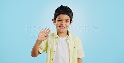 Buy stock photo Kid, hand and waving with smile in studio on blue background in mockup with excitement. Youth, boy and greeting while looking at screen with face for announcement of offer on social media, web or app