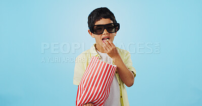 Popcorn, 3d or child in studio for a movie, watching tv or VR film on blue background with snack. Future technology, virtual reality experience or kid eating food for 3d cinema or metaverse show