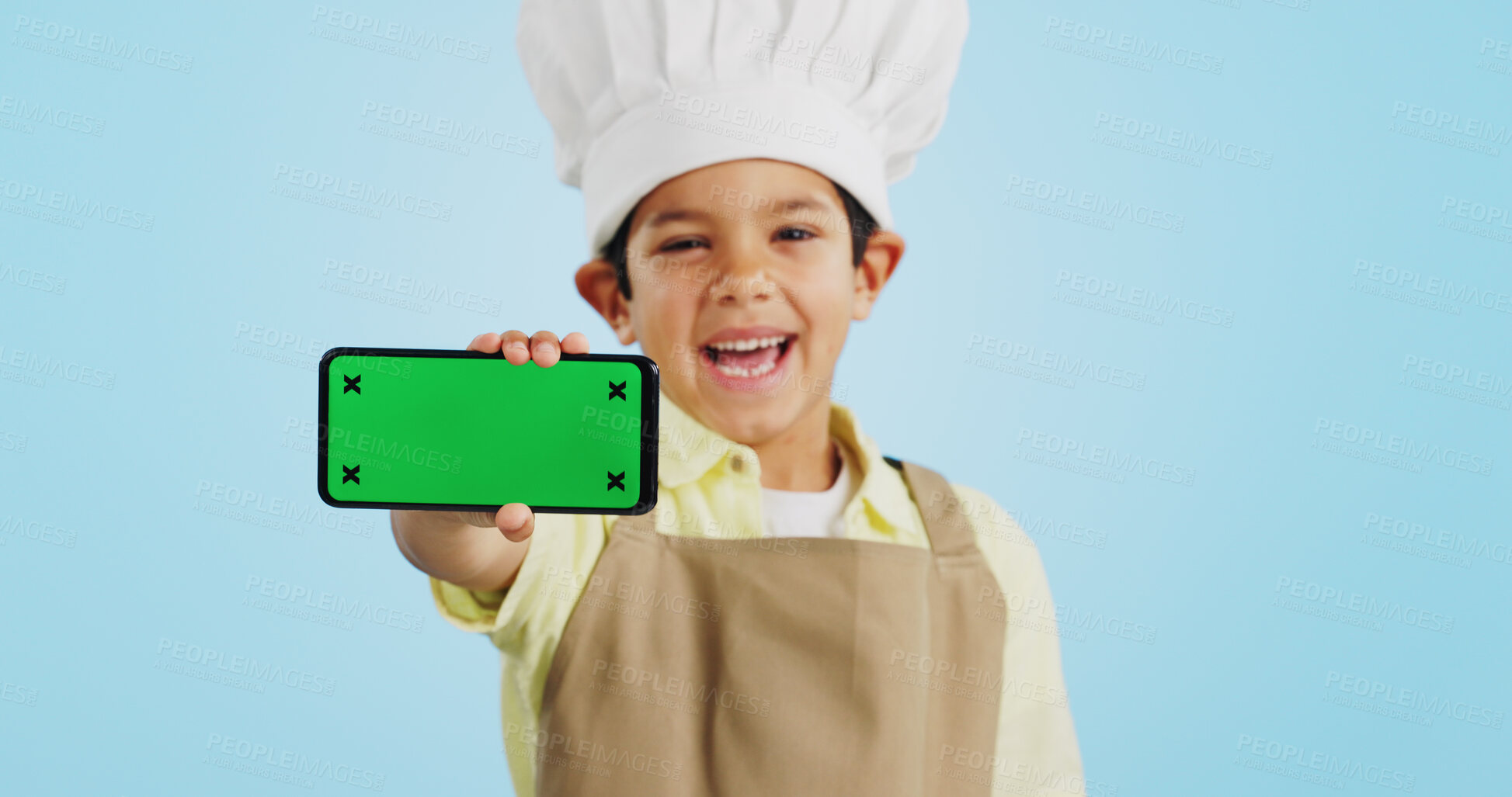 Buy stock photo Chef kid, face or phone green screen in studio for social media, cooking tutorial ads or download. Blue background, space or happy child with notification for online marketing, mockup or advertising