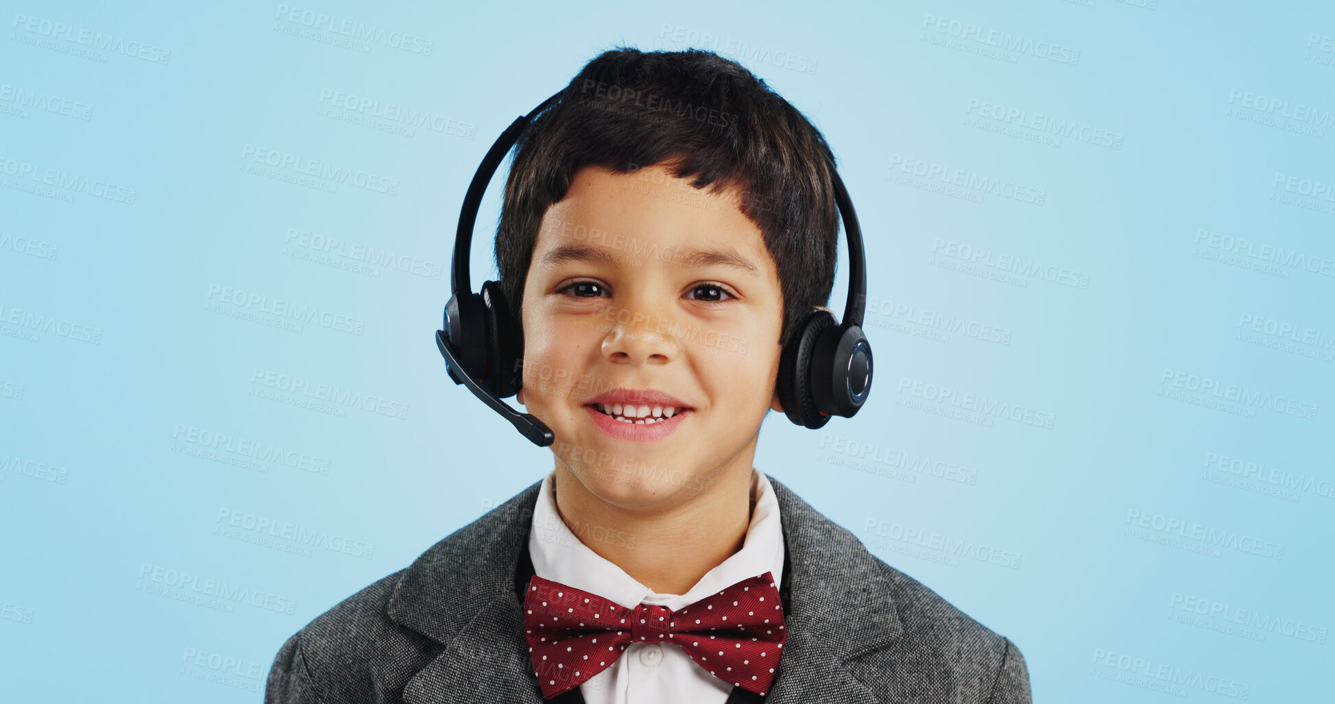 Buy stock photo Face, studio or child consultant in call center talking or networking for telecom on blue background. Young, contact or friendly kid sales agent in communication or conversation at customer service