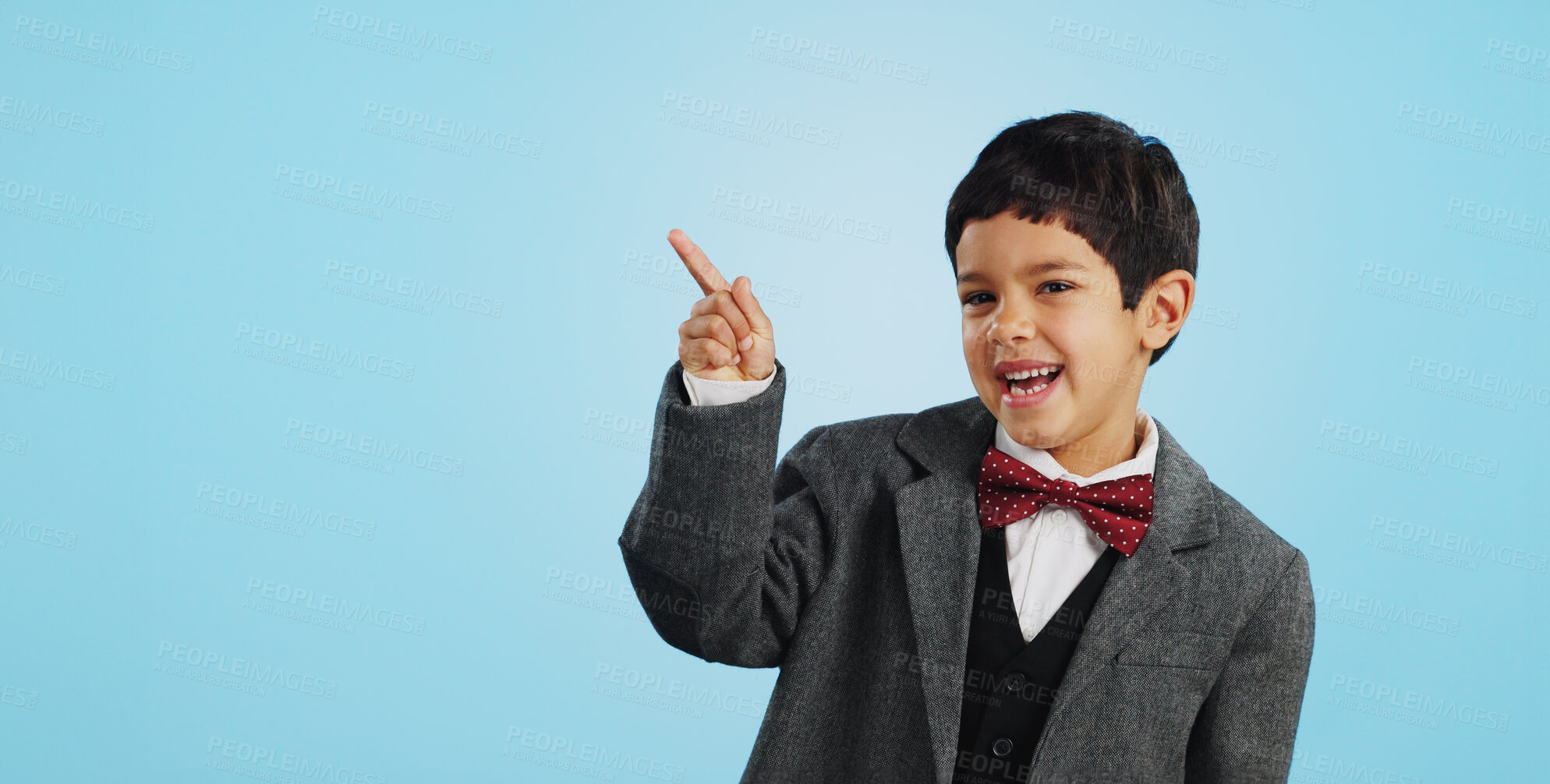 Buy stock photo Pointing, face or happy child in studio for offer, discount deal or retail sale on mockup space or logo advertising. Business, funny or excited boy with smile, news or kids promo on blue background