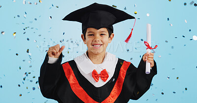 Buy stock photo Graduate, child and celebration with confetti and happy dance in studio on blue background for education. Development, kid and success with excited expression, diploma or certificate for achievement