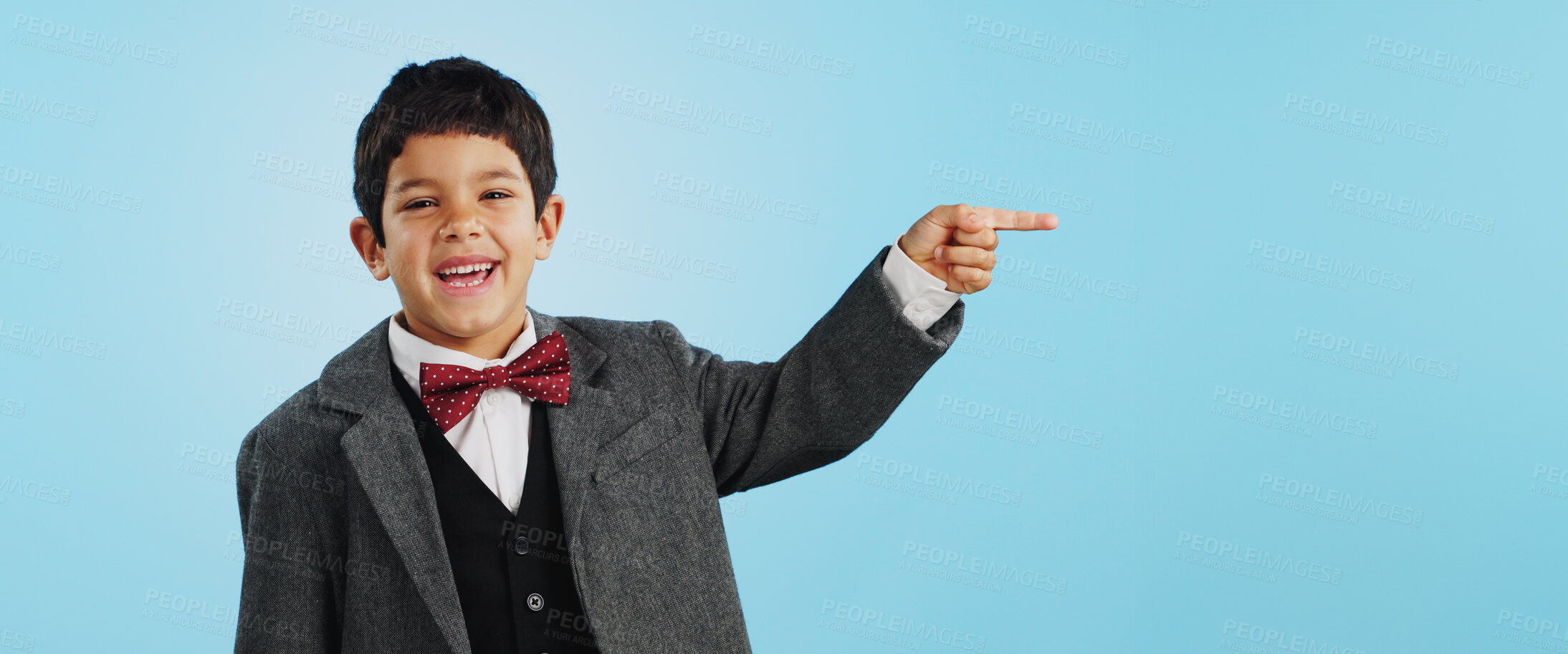 Buy stock photo Pointing, face or happy child in studio for offer, discount deal or retail sale on mockup space or logo advertising. Business, funny or excited boy with smile, news or kids promo on blue background