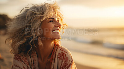 Candid shot of happy senior woman on beach during sunset. Lifestyle concept.