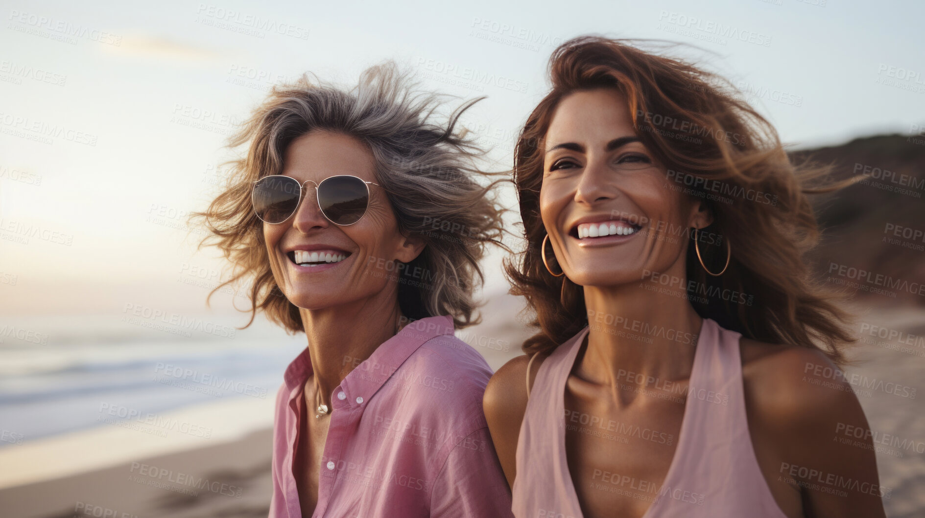 Buy stock photo Happy senior friends walking on empty beach. Sunset, golden hour.