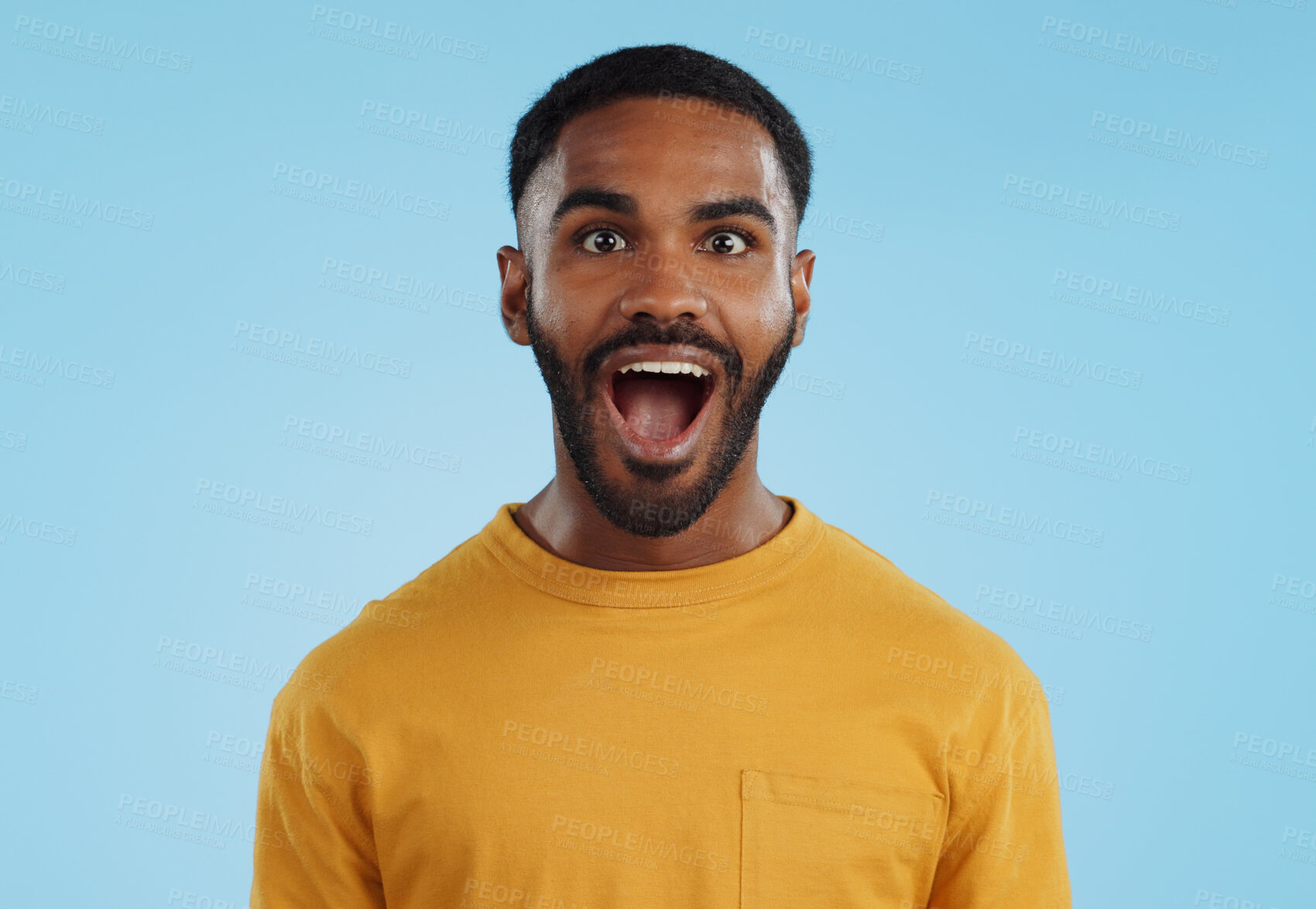 Buy stock photo Wow and excited black man in studio isolated on a blue background mockup space. Portrait, surprise and happy person in shock for good news, information and winner of bonus promotion