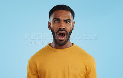 Buy stock photo Face, surprise and man with gossip, news and announcement on a blue studio background. Portrait, person and model with shock, expression and mockup space with wow, omg and emoji with secret and icon