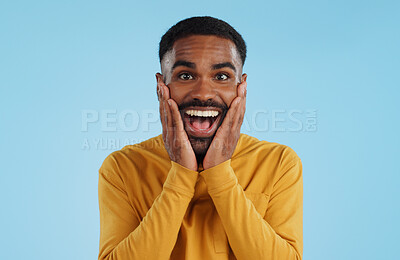 Buy stock photo Hands on face, wow and excited black man in studio isolated on a blue background mockup space. Portrait, surprise and happy person in shock for good news, information and winner of bonus promotion