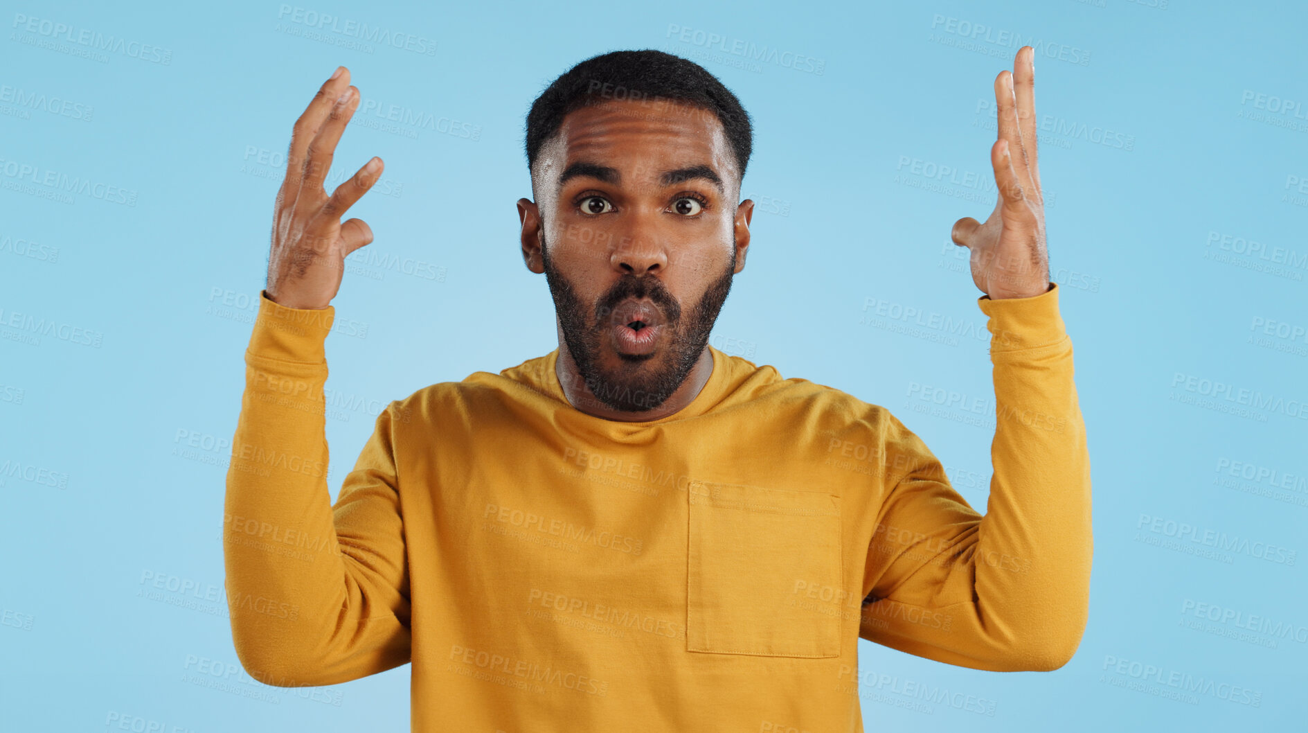 Buy stock photo Wow, face and man with mind blowing news in studio with shocked, gesture or expression on blue background. Surprise, portrait and male model with hand emoji for unexpected deal, announcement or info