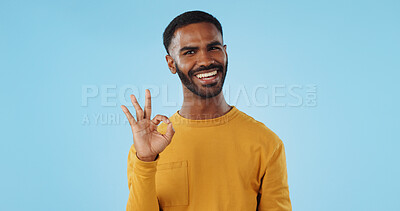 Buy stock photo Happy, face and man with perfect hands in studio for support, review or success, vote or agree on blue background. Smile, portrait and male model show ok, emoji or yes, thank you or feedback results