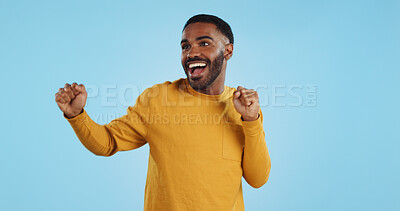 Buy stock photo Dance, man and excited for party in studio to celebrate success, promotion and winning lotto on blue background. Happy young model, giveaway winner and energy for disco, groovy music and freedom