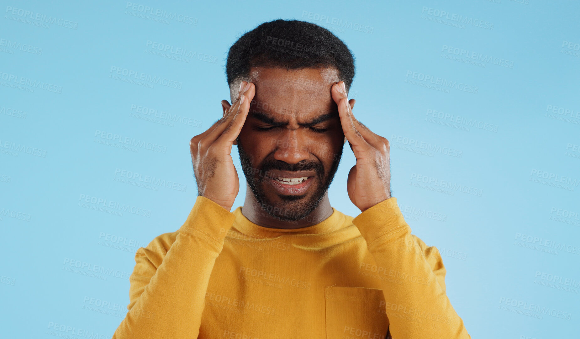 Buy stock photo Stress, tired and a man with headache pain on a blue background from burnout or anxiety. Mental health, fatigue and a person with a migraine massage, frustrated and with depression and anger