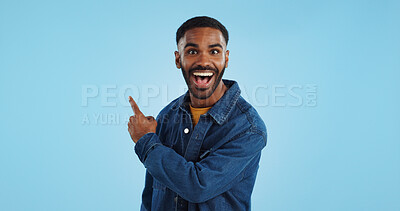 Buy stock photo Advertising studio smile, man and pointing at ads commercial, retail information or discount announcement. Sales info, mockup space and portrait person show service, deal or news on blue background