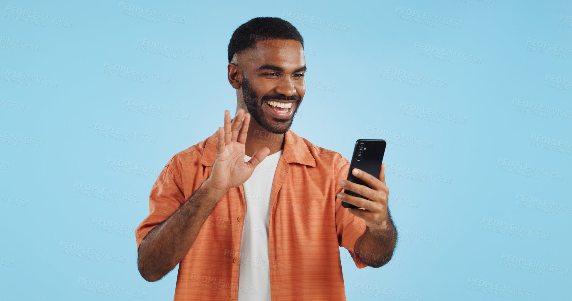 Buy stock photo Video call, wave and man with a smartphone, showing and conversation on a blue studio background. Person, speaking and model with a cellphone, online chat and communication with network or connection