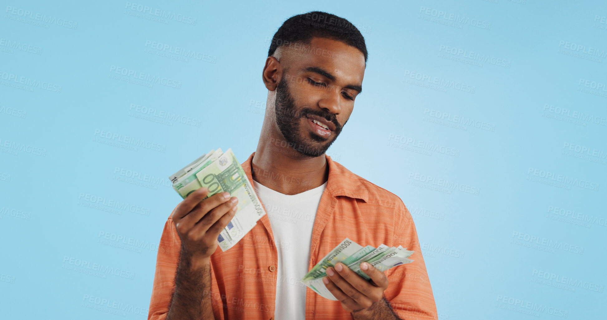 Buy stock photo Man, count cash and happy in studio with success, bonus or promotion with winning by blue background. Investor, trader or person with Euro money, salary or savings with smile for financial freedom goal