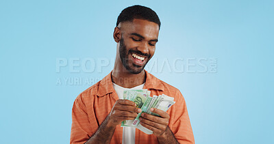 Buy stock photo Man, count cash and happy in studio with success, bonus or promotion with winning by blue background. Investor, trader or person with Euro money, salary or savings with smile for financial freedom goal