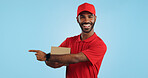 Advertising studio smile, delivery man and point at supply chain commercial, discount export info or distribution schedule. Courier service deal, mockup space and portrait person on blue background