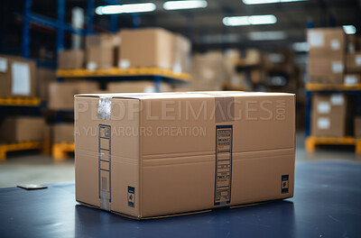 Package on warehouse table. Big warehouse in background. Delivery concept.