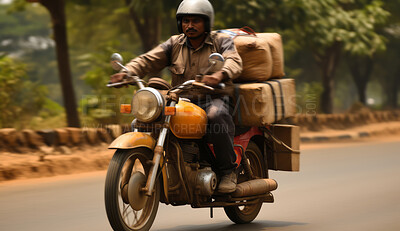 Delivery man on riding motorcycle. Lots of packages on back of vehicle.