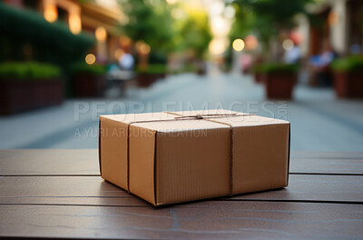 Package on table. Street in background. Delivery concept.